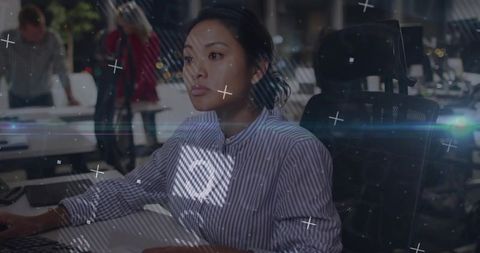 Focused professional woman working in modern office