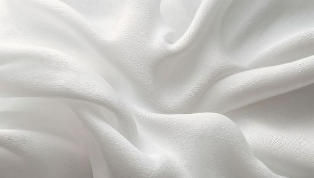 White Crepe Fabric Draping with Soft Flowing Folds and Subtle Sheen