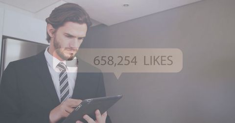businessman tracking social media likes on tablet - Download Free Stock Images Pikwizard.com
