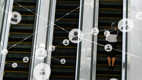 Businesswoman Networking on Escalator with Digital Icons
