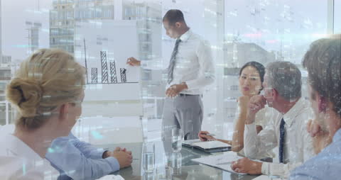 Diverse Business Team Analyzing Graph in Modern Office