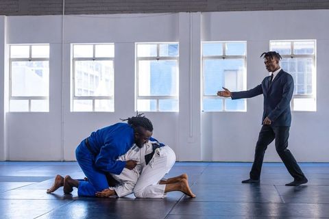 Martial arts training with african american athletes and coach oversight