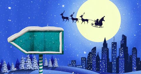 Santa and Reindeer Flying Over Snowy City in Winter Night