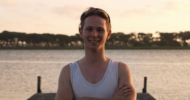 Young Man Enjoying Serene Lake Sunset - Download Free Stock Images Pikwizard.com