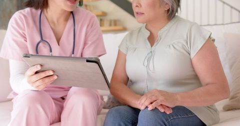 Nurse with Tablet Discussing Care Plan with Senior Woman during Home Visit - Download Free Stock Images Pikwizard.com
