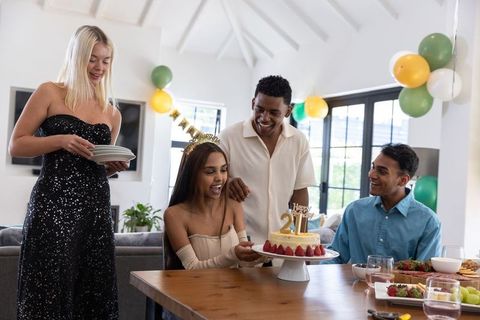 Diverse Friends Enjoying a Birthday Celebration with Decorated Cake