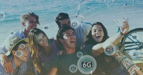 Diverse Friends Enjoying Beach Smartphone Moment Overlaid with 6G Graphics