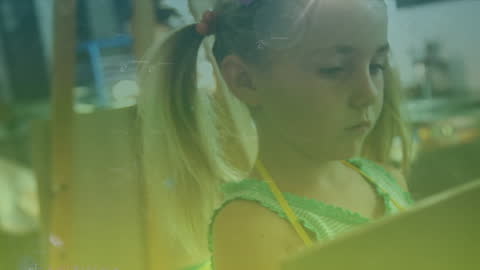 Young Girl Painting While Mathematics Overlay Appears