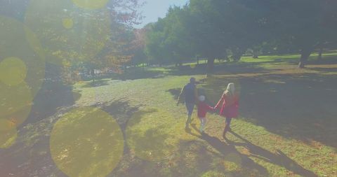 Caucasian Family Enjoying Walk Through Sunny Park - Download Free Stock Images Pikwizard.com