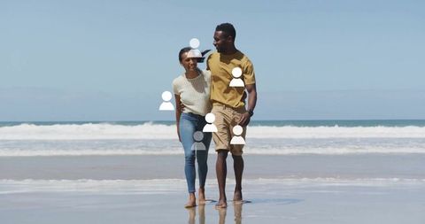 Romantic Couple Strolling Barefoot by Ocean Waves