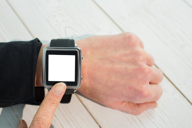 Transparent Smartwatch Interaction by Businessperson on Wooden Table - Download Free Stock Videos Pikwizard.com