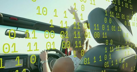Woman driving convertible with digital binary overlay on sunny day