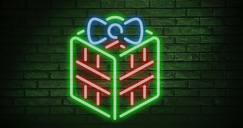 Neon Christmas Gift Sign on Green Brick Wall - Download Free Stock Images Pikwizard.com