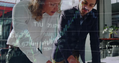 Dynamic Business Team Analyzing Financial Data with Overlapping Stock Charts