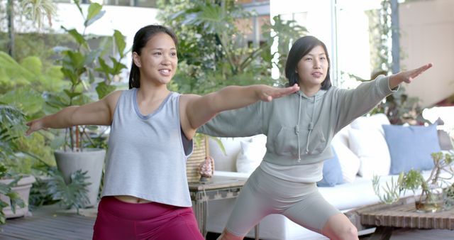 Two Women Practicing Yoga in Modern Garden - Download Free Stock Images Pikwizard.com