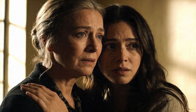 Mother and daughter embracing in window light, emotional intimate closeup portrait