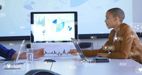 Team analyzing data dashboards and charts during modern business meeting