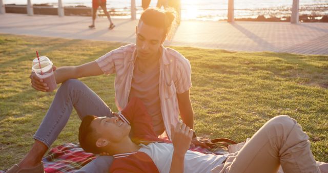 Romantic Couple Relaxing at Park During Sunset with Smoothie - Download Free Stock Images Pikwizard.com