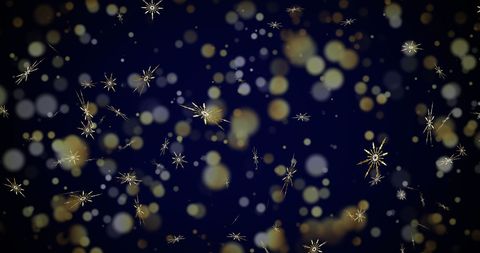 Falling Snowflakes and Soft Golden Lights on Deep Blue Background