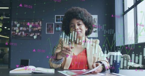 Woman interacting with holographic stock charts in modern office for remote trading, data analysis