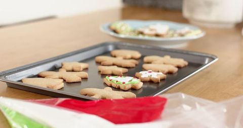 Homemade gingerbread cookies on tray with festive icing