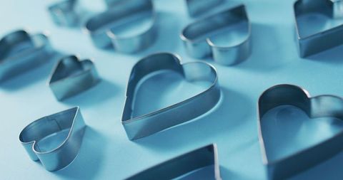 Heart-Shaped Cookie Cutters with Blue Background for Valentine's Day