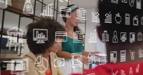 Diverse Colleagues Engaged in Creative Business Planning with Digital Icons Overlay