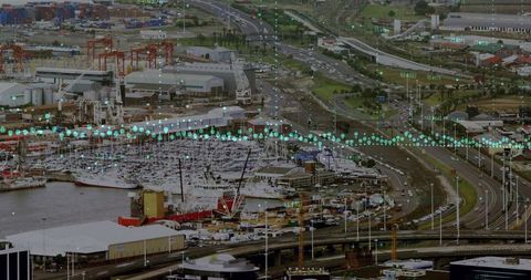 Aerial industrial harbor with iot data overlay smart port traffic and vessel monitoring