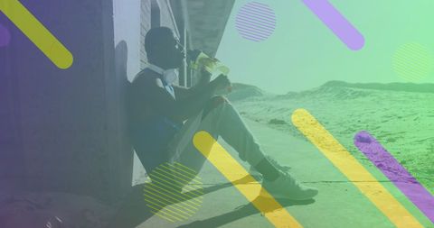 Man Relaxing After Workout at Beach with Vibrant Overlay