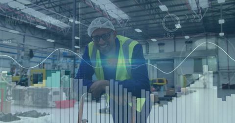 Factory Worker Analyzing Data with Overlayed Graphs