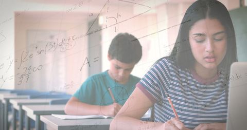Schoolgirl using laptop with mathematical equations overlay - Download Free Stock Images Pikwizard.com