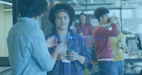 People socializing in modern office with technology overlay