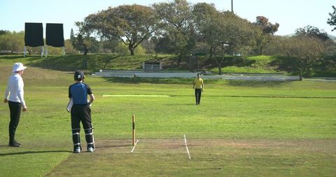 Cricket enthusiasts engaging in friendly competition on the field
