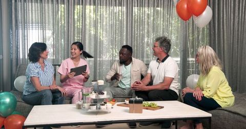 Diverse Group Relaxing During Physio Treatment Celebration