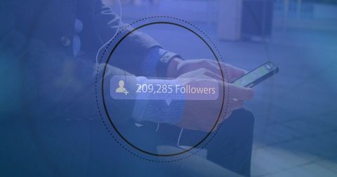Growing social media followers displayed over businessman using smartphone