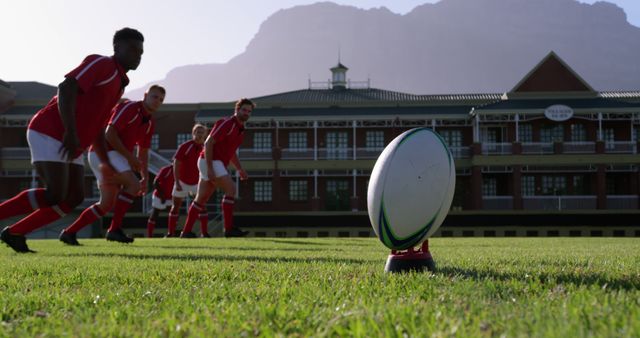 Rugby Team Preparing for Kickoff on Field with Mountain in Background - Download Free Stock Images Pikwizard.com