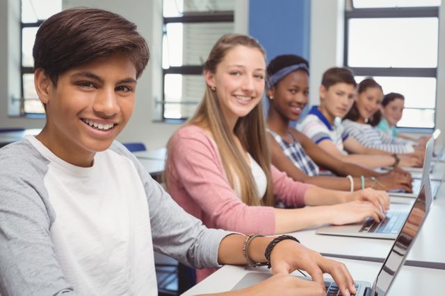 Diverse Group of Students Using Laptops in Classroom - Download Free Stock Photos Pikwizard.com