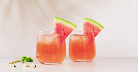 Refreshing watermelon drink with ice and fresh garnish