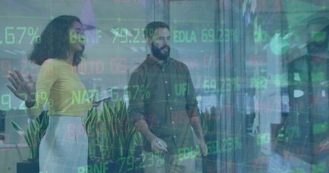 Multiracial team discussing stock market data in modern office