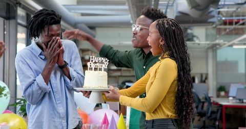 Colleagues Surprise Birthday Celebration in Office
