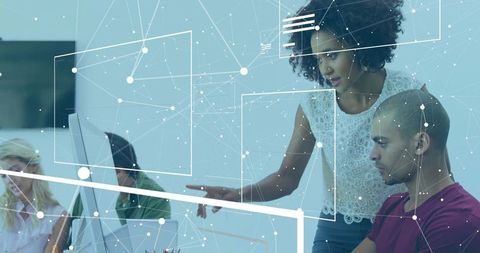 Team Collaborating on Digital Data Visualization in Modern Workspace