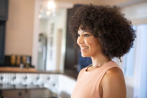 Cheerful African American Woman in Stylish Kitchen