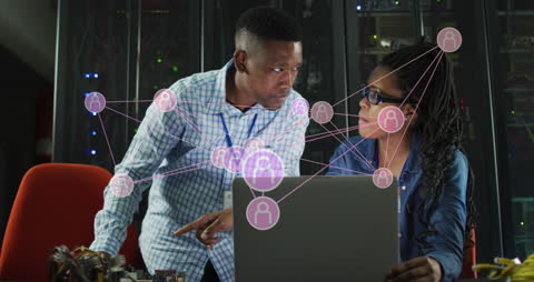 Engineers Collaborating in Server Room with Digital Overlay