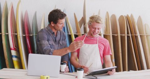 Surfboard Makers Collaborating in Workshop on Business Strategy