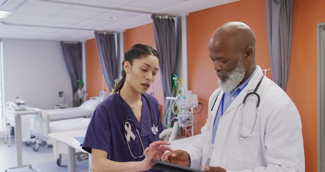 Medical Professionals Discussing Patient Data in Hospital Room - Download Free Stock Images Pikwizard.com