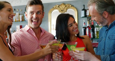 Cheerful Friends Enjoying Cocktails at Trendy Bar Gathering - Download Free Stock Images Pikwizard.com