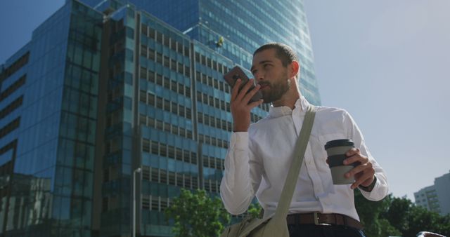 Confident Businessman Talking on Smartphone in Urban Setting - Download Free Stock Images Pikwizard.com