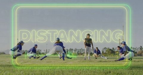 Softball team stretching with neon distancing text