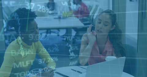 Businesswomen Discussing Financial Data and Stock Market Trends - Download Free Stock Images Pikwizard.com