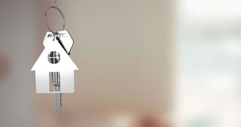 House-shaped Keychain Holding Keys in Modern Interior